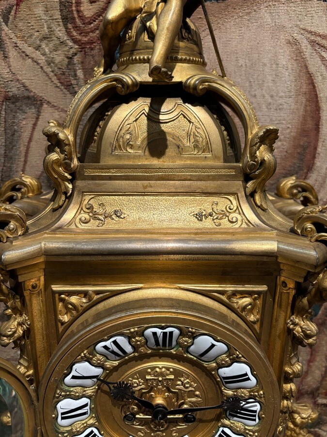 Large pendulum clock in gilt bronze with cut glass 19th century. Representation of Chronos figure , winged Mythological beasts and decorations in bronze working with a suns balance. Richly decorated dial signed R.COTTIN.26 Rue Amelot PARIS