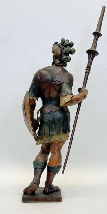 Large polychrome oak sculpture of a soldier/warrior late 19th century   Very decorative and detailed carving of a warrior with shield and spear. In very good condition. Dimensions : Height : 109 / 134 cm  Width : 49 cm Depth : 39 cm Foot : 26 x 21,5 cm Be