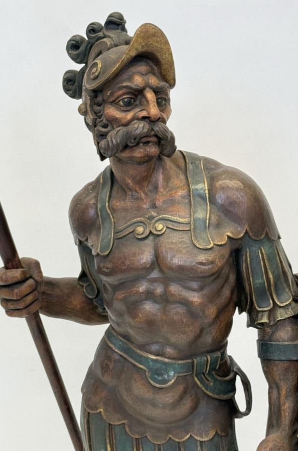 Large polychrome oak sculpture of a soldier/warrior late 19th century   Very decorative and detailed carving of a warrior with shield and spear. In very good condition. Dimensions : Height : 109 / 134 cm  Width : 49 cm Depth : 39 cm Foot : 26 x 21,5 cm Be