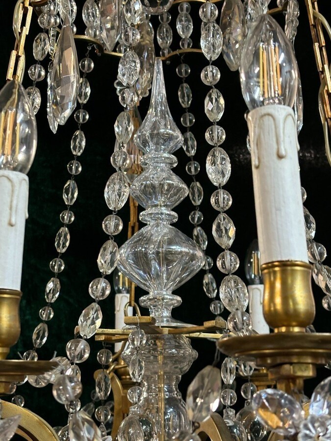 Nice Large Chandelier In Bronze And Crystal Late 19th Century. The Chandelier Has 10 Light Points On The Outer Rim And 6 Light Points Inside. Wiring Has Been Renewed And Is Therefore In Good Condition.