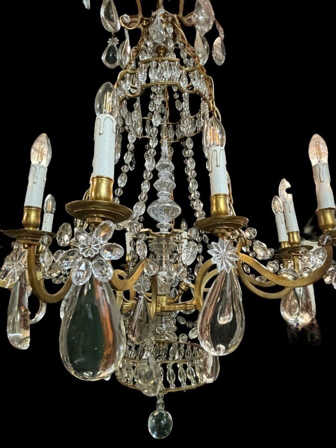 Nice Large Chandelier In Bronze And Crystal Late 19th Century. The Chandelier Has 10 Light Points On The Outer Rim And 6 Light Points Inside. Wiring Has Been Renewed And Is Therefore In Good Condition.