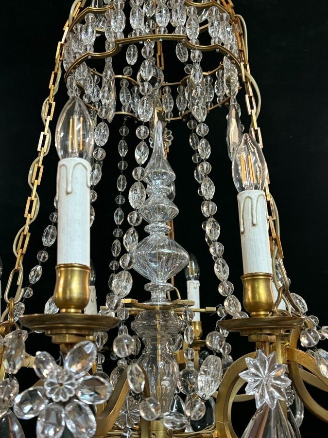 Nice Large Chandelier In Bronze And Crystal Late 19th Century. The Chandelier Has 10 Light Points On The Outer Rim And 6 Light Points Inside. Wiring Has Been Renewed And Is Therefore In Good Condition.