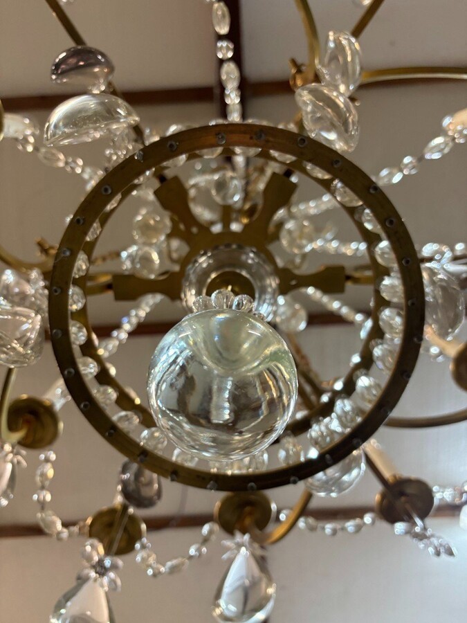 Nice Large Chandelier In Bronze And Crystal Late 19th Century. The Chandelier Has 10 Light Points On The Outer Rim And 6 Light Points Inside. Wiring Has Been Renewed And Is Therefore In Good Condition.