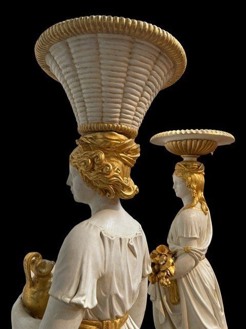 Pair of beautiful 19thc entury wooden pedestal sculptures. Very decorative female figures, finely carved in white with golden accents, resting on magnificent pedestals.