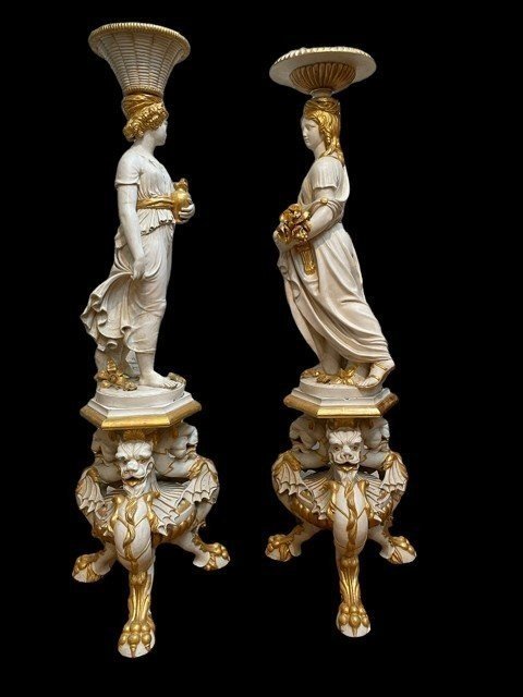 Pair of beautiful 19thc entury wooden pedestal sculptures. Very decorative female figures, finely carved in white with golden accents, resting on magnificent pedestals.