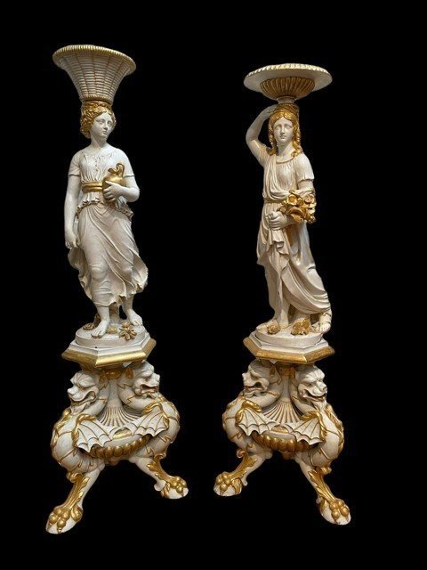 Pair of beautiful 19thc entury wooden pedestal sculptures. Very decorative female figures, finely carved in white with golden accents, resting on magnificent pedestals.