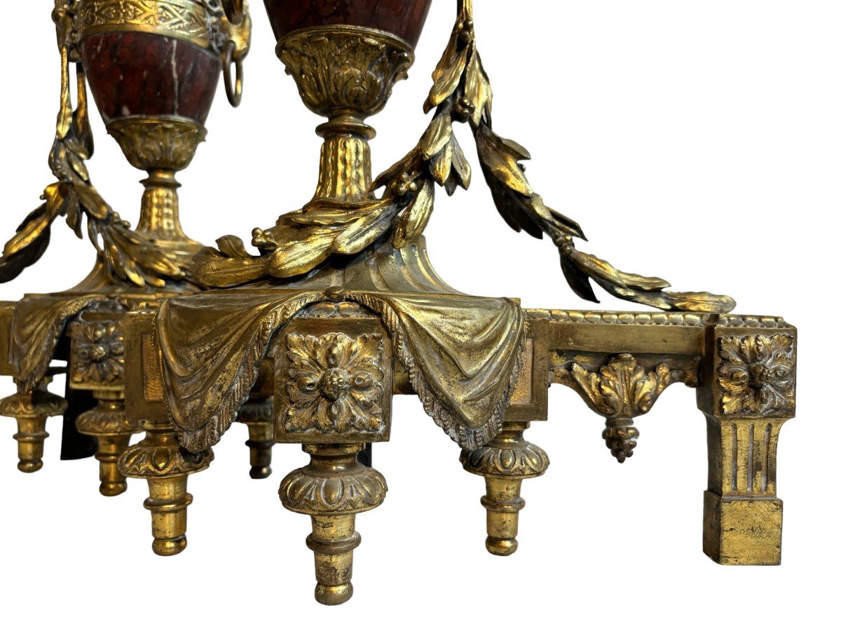 Pair of chenets Louis XVI style in gilt bronze and marble 19th century Beautiful pair of chenets with following dimensions : Height : 48 cm Width : 36 cm Depth : 19 cm In good condition , mid 19th century