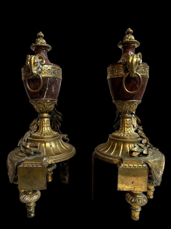 Pair of chenets Louis XVI style in gilt bronze and marble 19th century Beautiful pair of chenets with following dimensions : Height : 48 cm Width : 36 cm Depth : 19 cm In good condition , mid 19th century