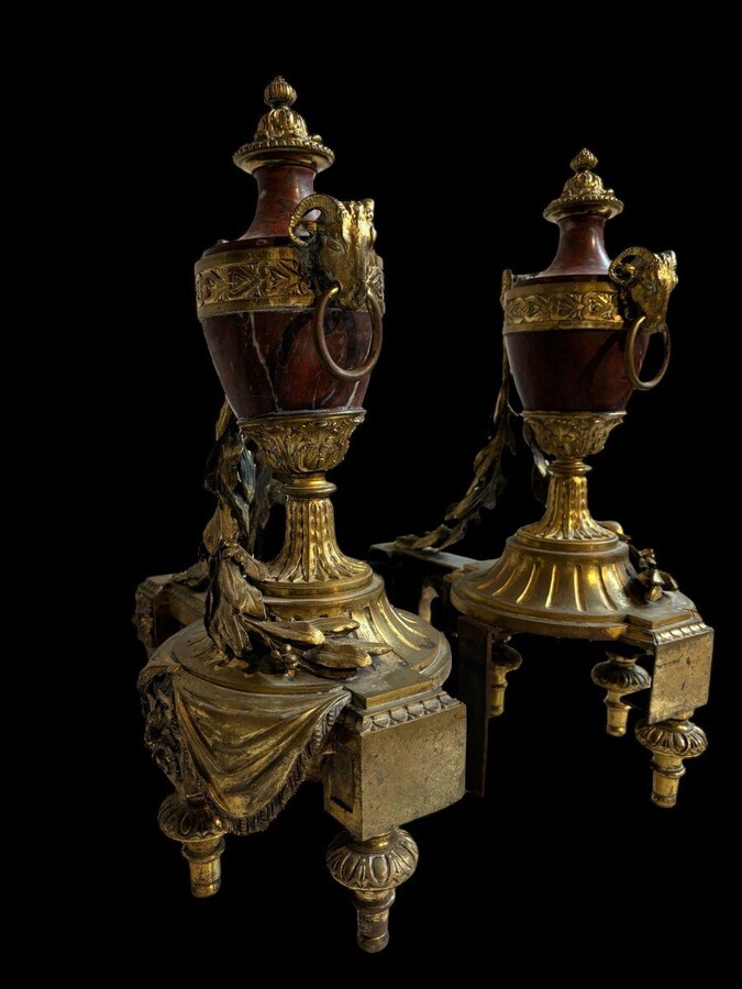 Pair of chenets Louis XVI style in gilt bronze and marble 19th century Beautiful pair of chenets with following dimensions : Height : 48 cm Width : 36 cm Depth : 19 cm In good condition , mid 19th century