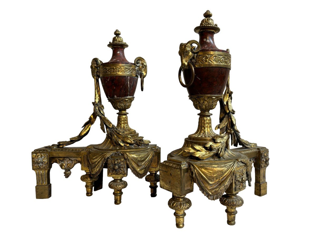 Pair of chenets Louis XVI style in gilt bronze and marble 19th century Beautiful pair of chenets with following dimensions : Height : 48 cm Width : 36 cm Depth : 19 cm In good condition , mid 19th century