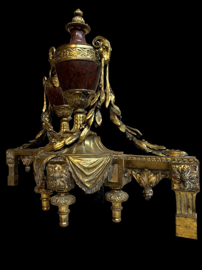 Pair of chenets Louis XVI style in gilt bronze and marble 19th century Beautiful pair of chenets with following dimensions : Height : 48 cm Width : 36 cm Depth : 19 cm In good condition , mid 19th century