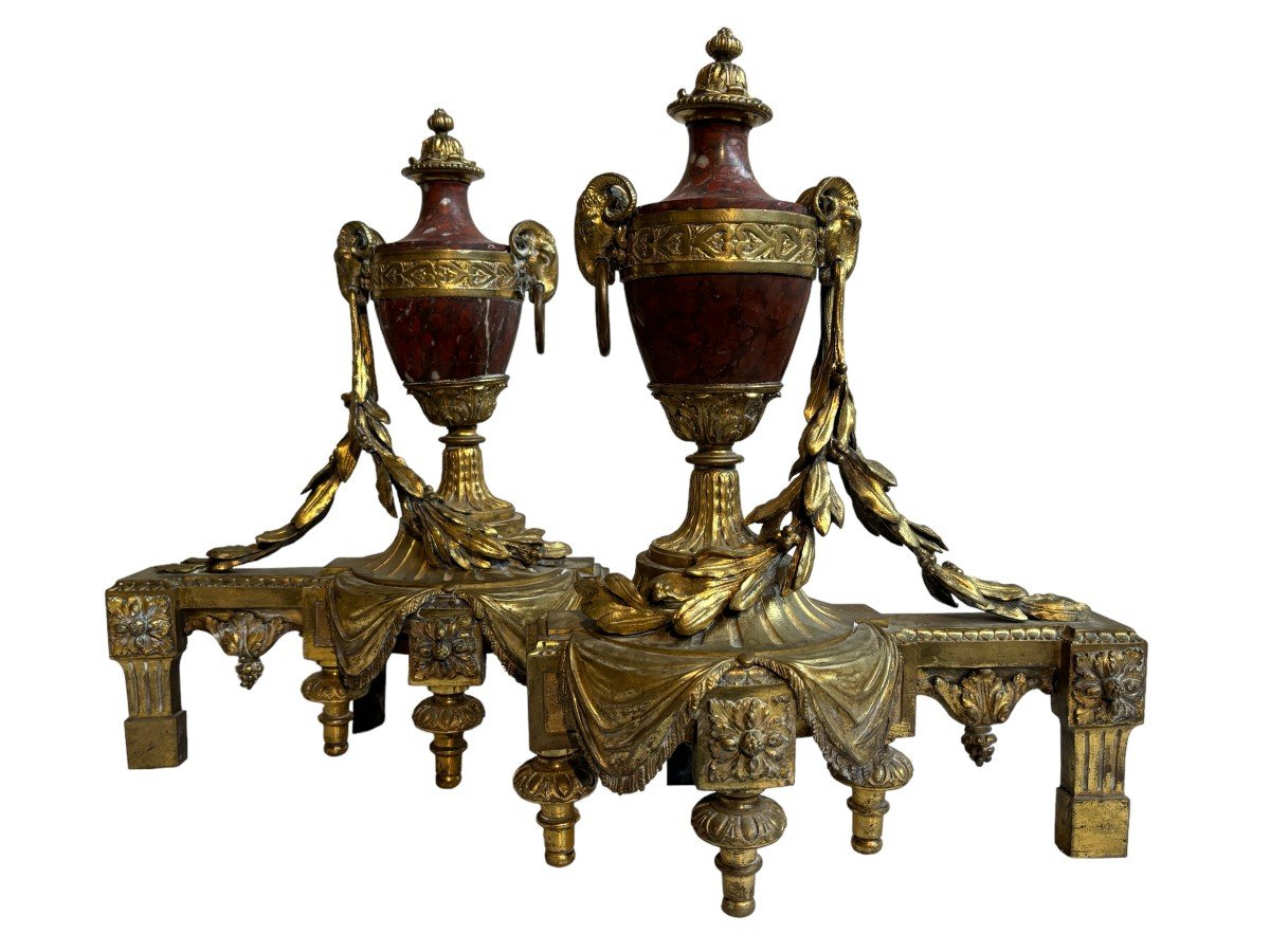 Pair of chenets Louis XVI style in gilt bronze and marble 19th century Beautiful pair of chenets with following dimensions : Height : 48 cm Width : 36 cm Depth : 19 cm In good condition , mid 19th century