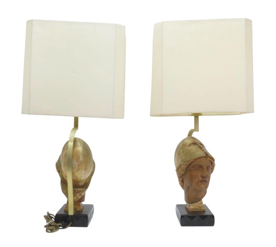 Pair of decorative lampadaires ‘ head of Athena ’ in wood 20th century Highly decorative lamp bases in wood with gold accents / copper standing on a black lacquer base in wood.