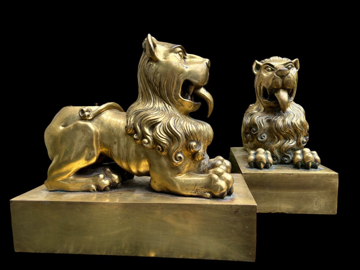 Pair of gilt bronze lions on plinth early 19th century. Very decorative lions formerly served as the leg of a very large candlestick or furniture. Very suitable to make them into beautiful lamp bases or just to put down as decorative objects.