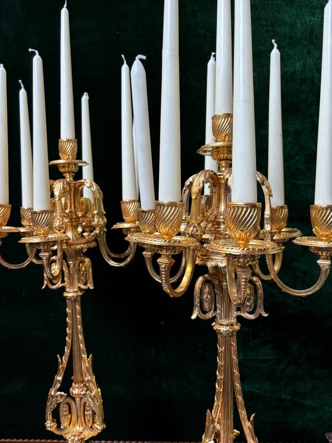 Pair of large gilt bronze candlesticks Napoleon III Very elegant candlesticks with 7 candleholders , decorated with ornaments and resting on a gilt bronze / white marble base Dimensions : Height : 74 cm Width : 31 cm Both are in very good condition