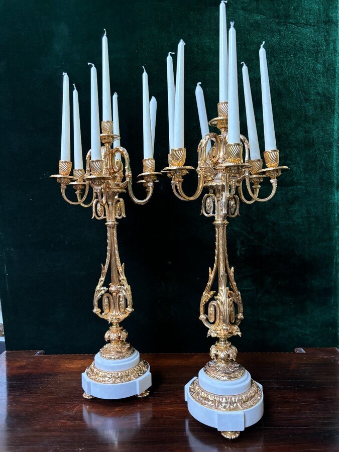 Pair of large gilt bronze candlesticks Napoleon III Very elegant candlesticks with 7 candleholders , decorated with ornaments and resting on a gilt bronze / white marble base Dimensions : Height : 74 cm Width : 31 cm Both are in very good condition