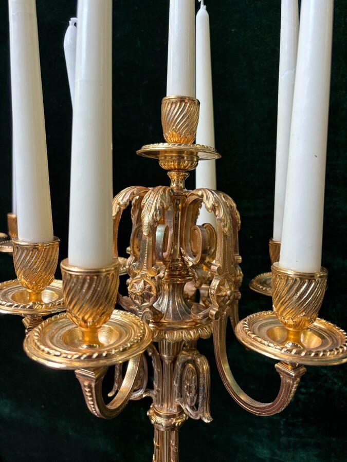 Pair of large gilt bronze candlesticks Napoleon III Very elegant candlesticks with 7 candleholders , decorated with ornaments and resting on a gilt bronze / white marble base Dimensions : Height : 74 cm Width : 31 cm Both are in very good condition