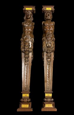 Pair of large Karyatids in walnut late 19th century. Highly decorative karyatids in very finely sculpted walnut depicting a woman and a man Capitals and base at bottom are separate elements. Both in very good condition. Dimensions : Height : 140 cm Width