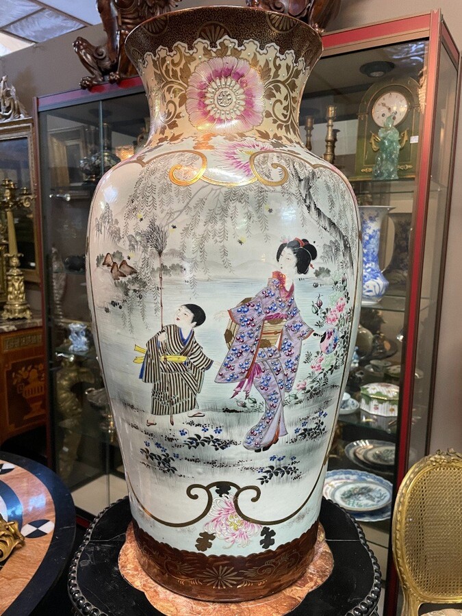 Pair of large porcelain vases Japan early 20th century ( 62 cm ). Vases in coloured porcelain with images of characters, ornaments, water and flora. Both are in very good condition with the following dimensions: Height: 62 cm Width: 34 cm