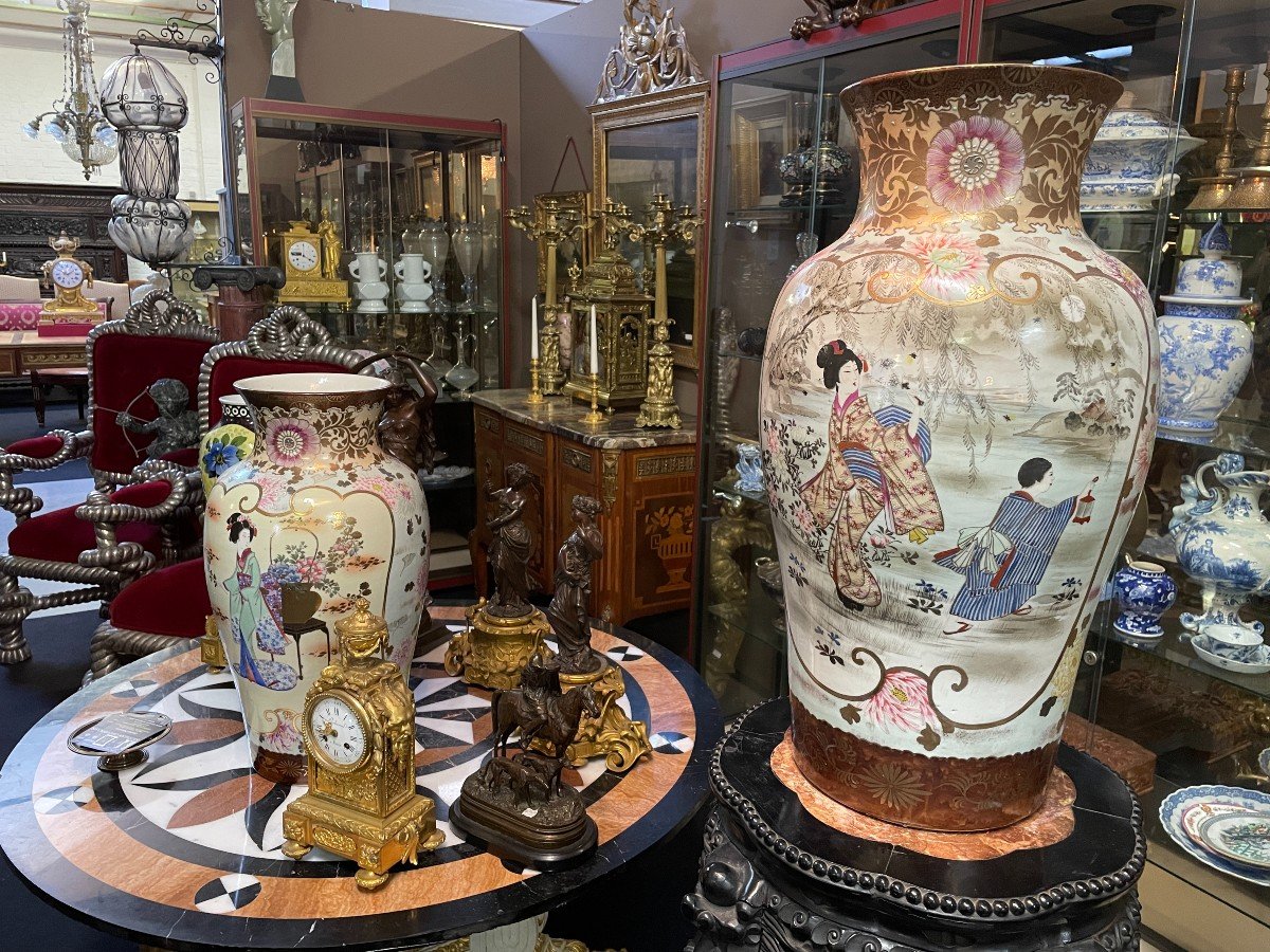 Pair of large porcelain vases Japan early 20th century ( 62 cm ). Vases in coloured porcelain with images of characters, ornaments, water and flora. Both are in very good condition with the following dimensions: Height: 62 cm Width: 34 cm