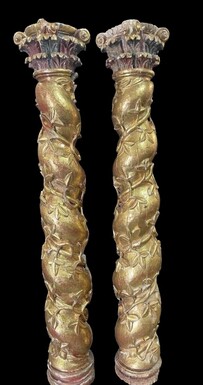 Pair of large twisted columns with capitals early 17th century. Highly decorative gilded wood sculpted columns from the Baroque period in good condition with old traces of woodworm. Dimensions : Height : 191 cm Width : 26 cm Baroque columns from 1650-1680