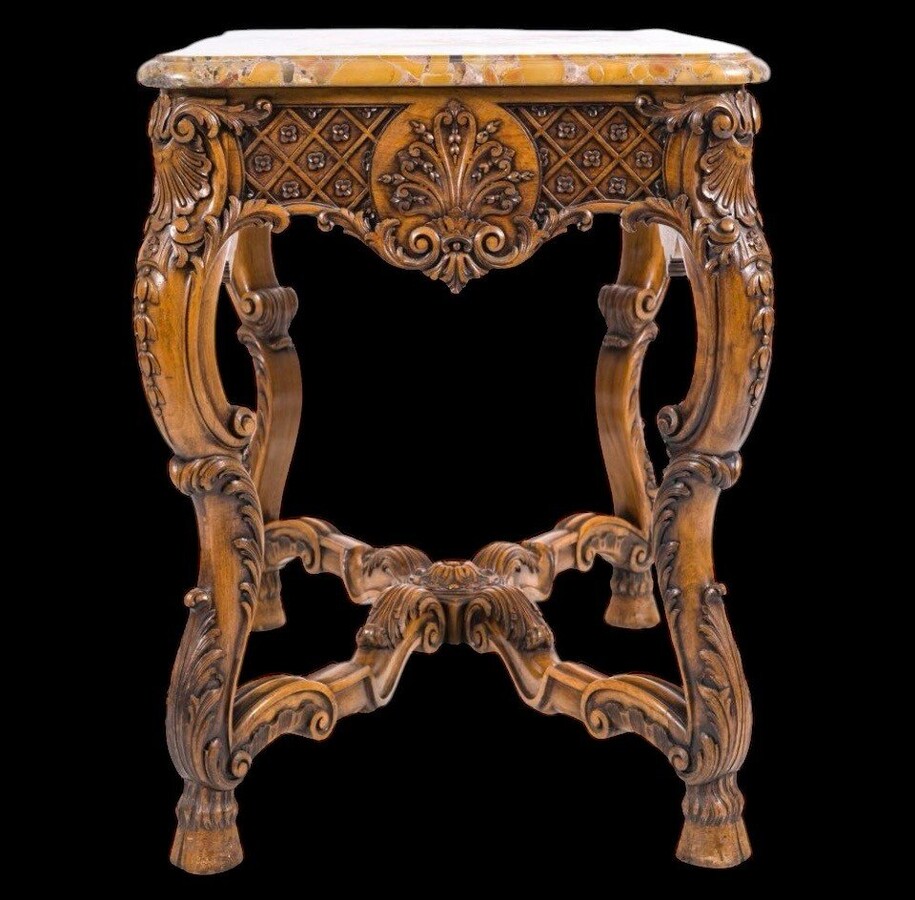 Richly carved wooden centre table with marble top Circa 1920 Attractive oak central table /console topped with Breche d'Alep marble Dimensions: Height: 80 cm. Width : 100 cm. Depth : 60 cm. In very good condition