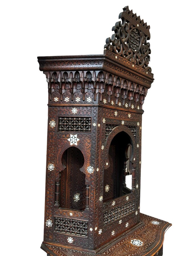 Sculpted furniture with inlays of ebony and mother-of-pearl. Syria , early 19th century. Furniture in used condition , consists of 2 parts with some missing pieces of wood Dimensions : Height : 234 cm Width : 86 cm Depth : 30 / 48 cm