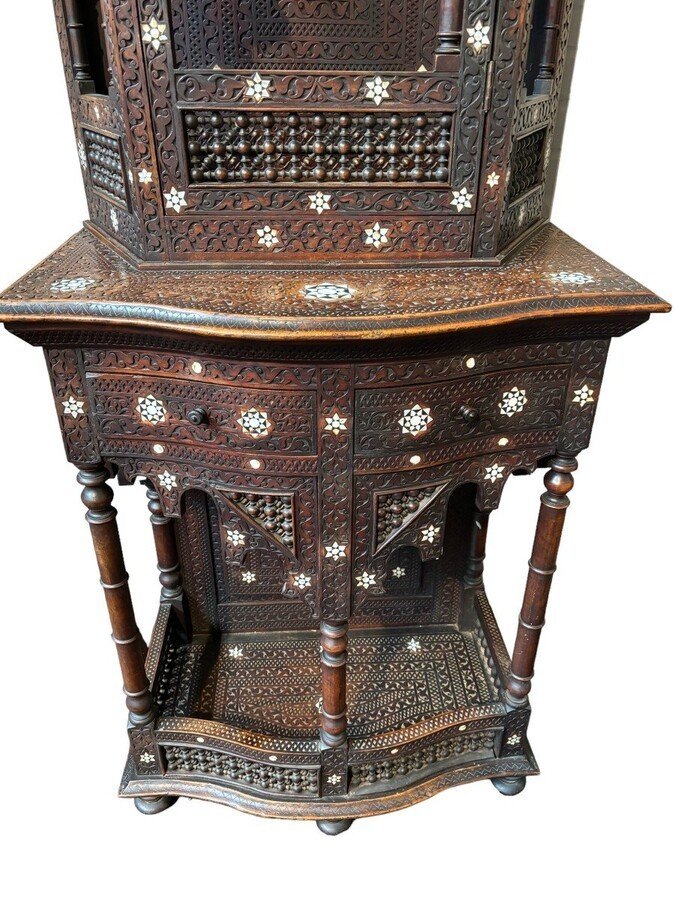 Sculpted furniture with inlays of ebony and mother-of-pearl. Syria , early 19th century. Furniture in used condition , consists of 2 parts with some missing pieces of wood Dimensions : Height : 234 cm Width : 86 cm Depth : 30 / 48 cm