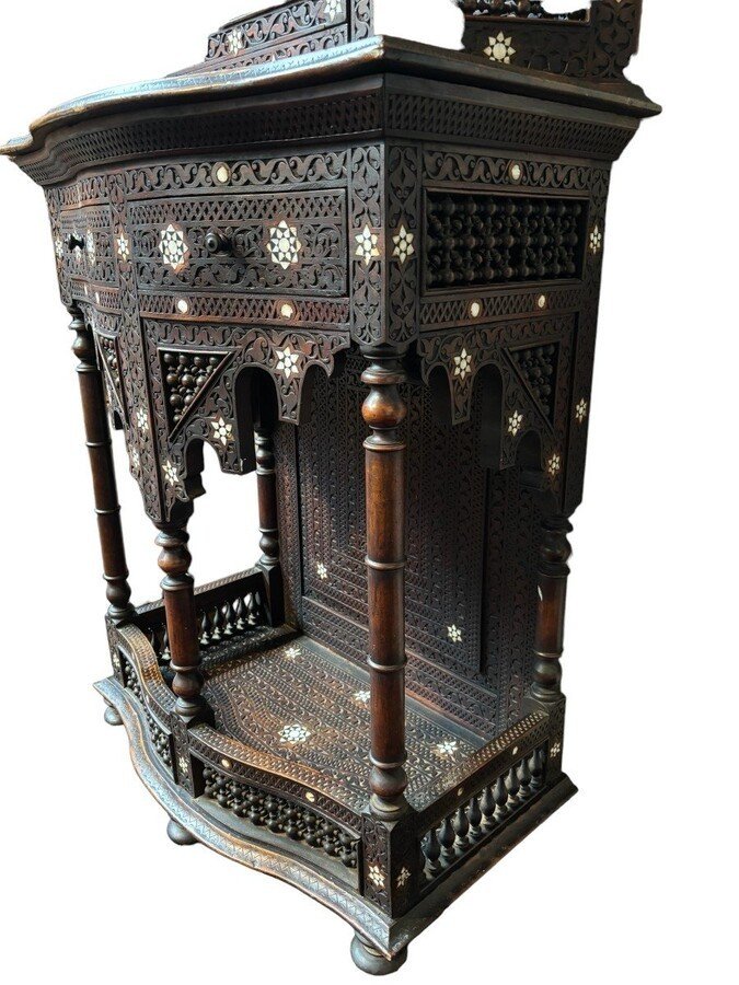 Sculpted furniture with inlays of ebony and mother-of-pearl. Syria , early 19th century. Furniture in used condition , consists of 2 parts with some missing pieces of wood Dimensions : Height : 234 cm Width : 86 cm Depth : 30 / 48 cm