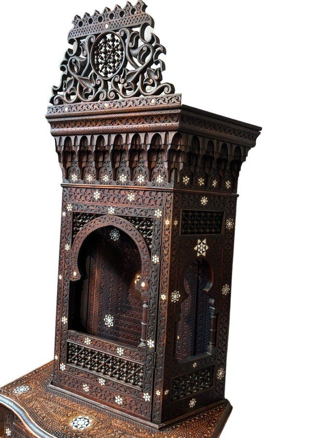 Sculpted furniture with inlays of ebony and mother-of-pearl. Syria , early 19th century. Furniture in used condition , consists of 2 parts with some missing pieces of wood Dimensions : Height : 234 cm Width : 86 cm Depth : 30 / 48 cm