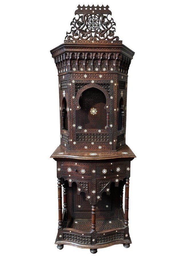 Sculpted furniture with inlays of ebony and mother-of-pearl. Syria , early 19th century. Furniture in used condition , consists of 2 parts with some missing pieces of wood Dimensions : Height : 234 cm Width : 86 cm Depth : 30 / 48 cm