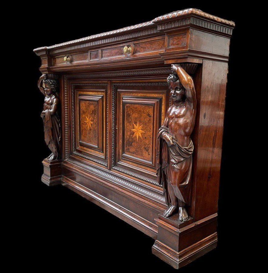 Special cabinet with 2 large sculptures in walnut 19th century. Beautiful cabinet with a distinct shape ( corner ) fitted with 2 doors and 2 drawers , 2 finely carved sculptures and inlaid marquetry in the doors. Locks in the drawers are missing.