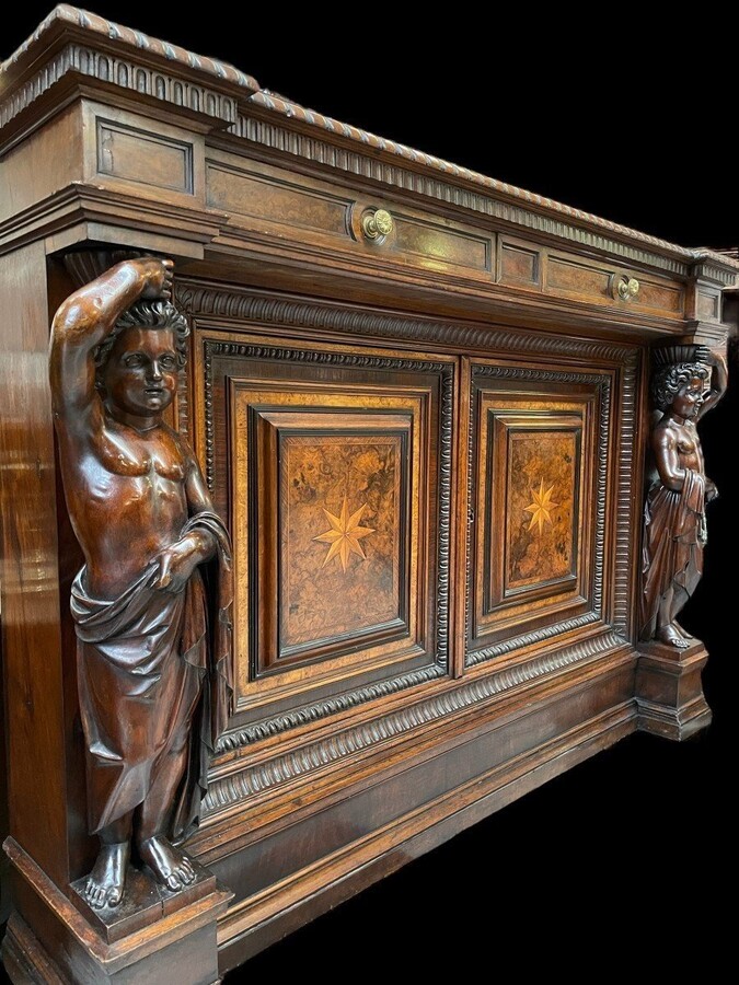 Special cabinet with 2 large sculptures in walnut 19th century. Beautiful cabinet with a distinct shape ( corner ) fitted with 2 doors and 2 drawers , 2 finely carved sculptures and inlaid marquetry in the doors. Locks in the drawers are missing.