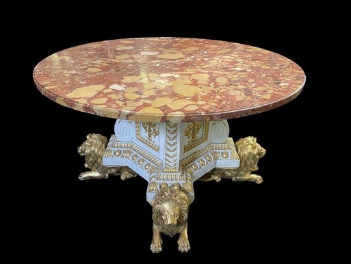 White and Gold Carved Wooden Table With Round Top In Breche d'Alep Marble. A white and gold carved wooden centre table with a round Breche d'Alep marble top resting on a central quadrangular shaft underlined by four inverted consoles and panels.